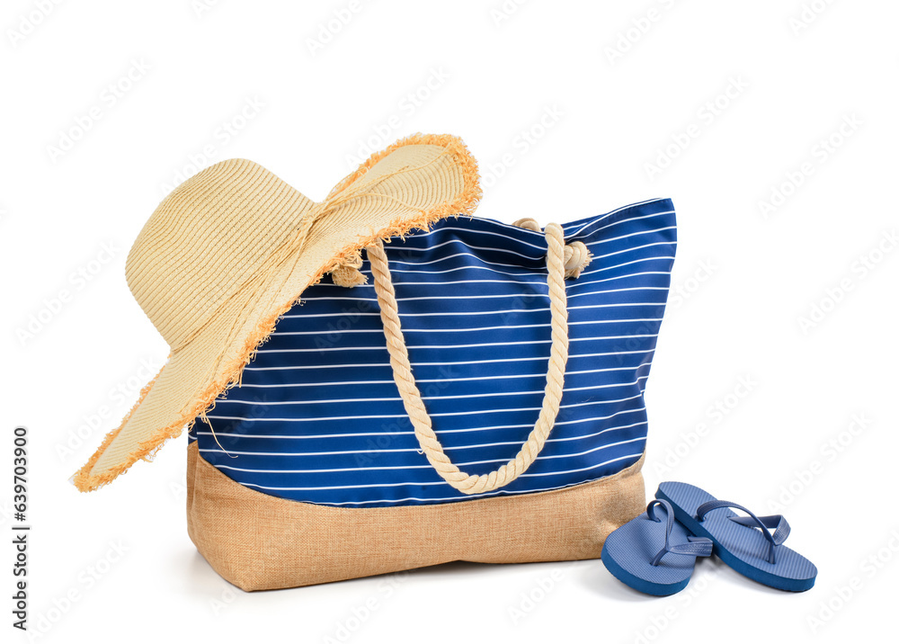 Ταπετσαρία Stylish beach bag with straw hat and flip-flops on white background