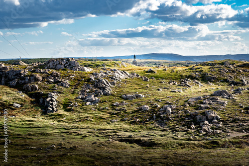 The John Cabot statue standing on rocky tundra along Cape Bonavista overlooking the Atlantic Ocean in Newfoundland and Labrador Canada. photo