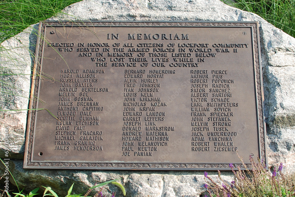 AUGUST 18, 2023. LOCKPORT, ILLINOIS, USA. A plaque honoring Lockport citizens who served in the military during World War II. It is in front of City Hall, also called the Central Square building.