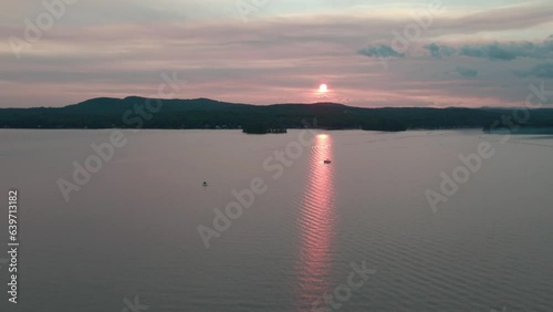 Speedboat on the lake at sunset photo