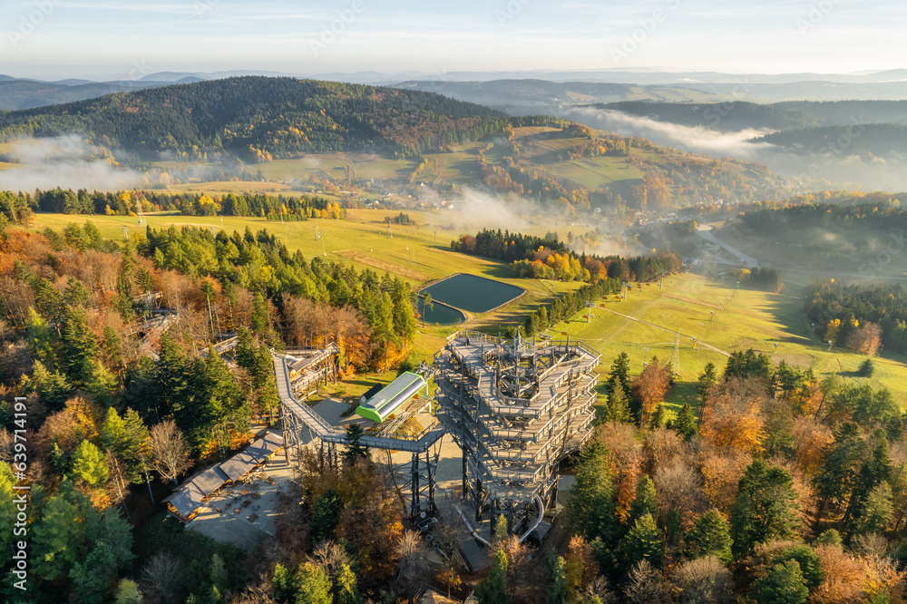 Tree top observation tower in resort town Krynica-Zdroj at sunrise, Poland