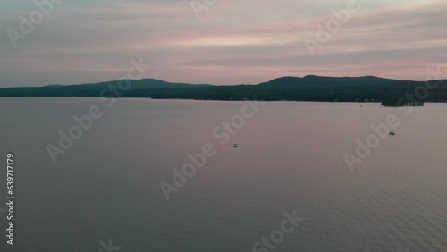 Boat cruise on a lake at sunset photo