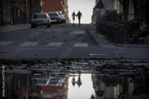 a view of a wet city street © niklas storm