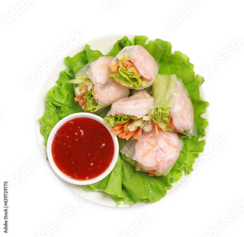 Tasty spring rolls served with lettuce and sauce on white background, top view