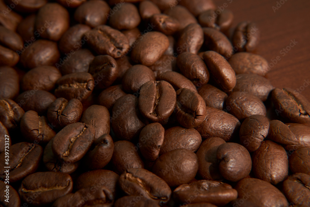 Aromatic Elegance: A close-up masterpiece capturing the intricate details of coffee beans on a rich wooden texture. The interplay of texture and aroma unfolds against a warm backdrop Aromatic Elegance: A close-up masterpiece capturing the intricate details of coffee beans on a rich wooden texture. The interplay of texture and aroma unfolds against a warm backdrop