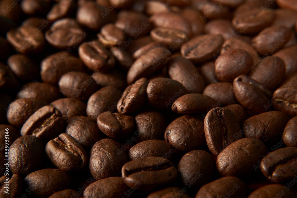 Aromatic Elegance: A close-up masterpiece capturing the intricate details of coffee beans on a rich wooden texture. The interplay of texture and aroma unfolds against a warm backdrop Aromatic Elegance: A close-up masterpiece capturing the intricate details of coffee beans on a rich wooden texture. The interplay of texture and aroma unfolds against a warm backdrop