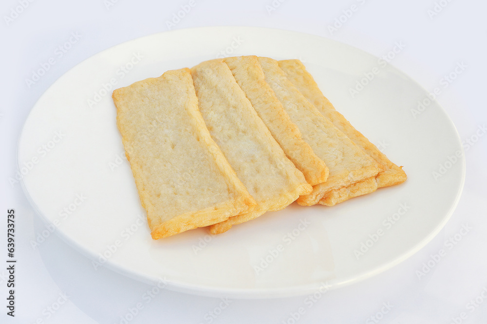Korean Thin Fish cake, square shaped on white background. Asian food fish cake, eomuk or odeng. Top view