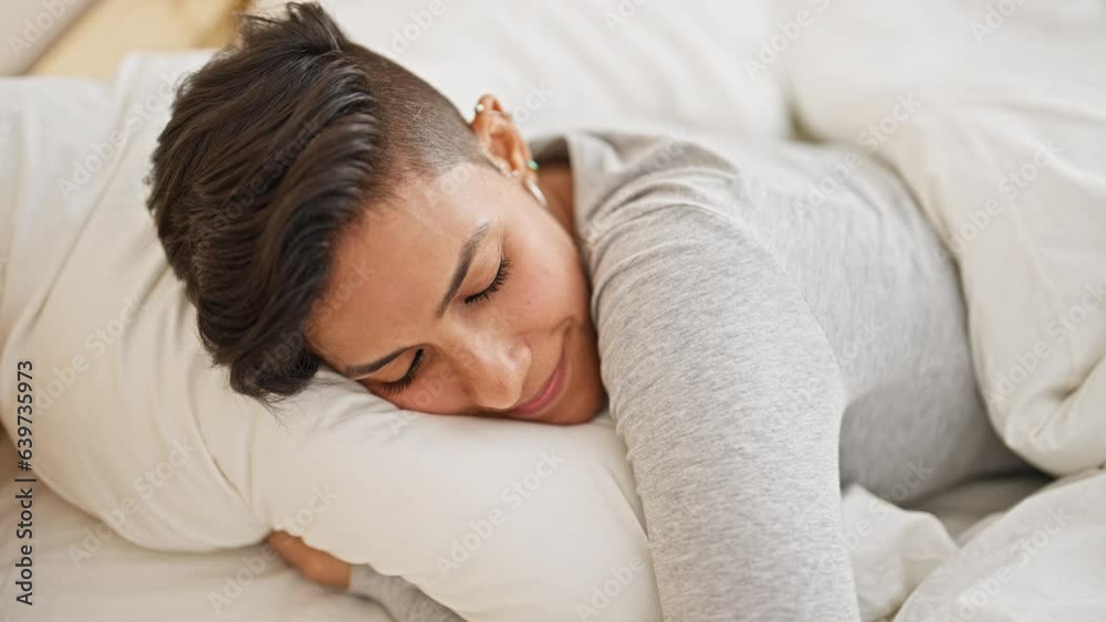 Young beautiful hispanic woman lying on bed sleeping at bedroom Young beautiful hispanic woman lying on bed sleeping at bedroom