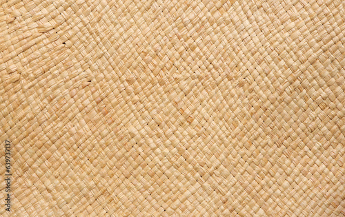 Brown wicker woven bag or straw bag. Woven natural straw texture as background. Wicker woven texture  photo