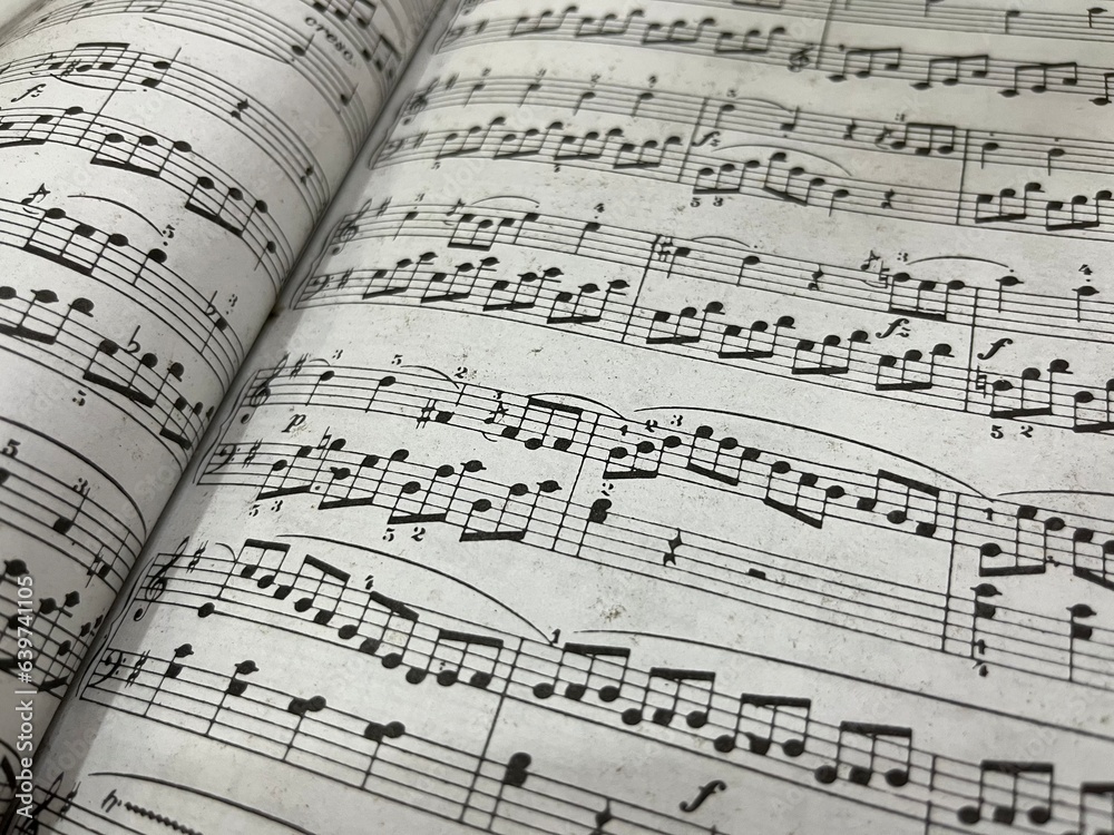 Piano musical paper sheets book isolated on landscape template Piano musical paper sheets book isolated on landscape template