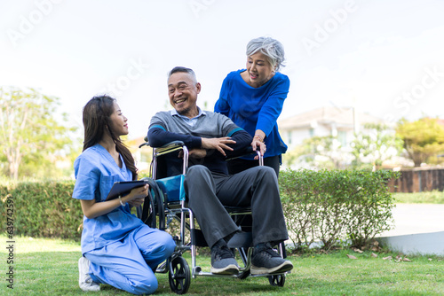 Portrait of smiling caring asian nurse service help support discussing and consulting taking care with senior elderly asian man and woman couple at home visit.senior retirement home care concept © Art_Photo