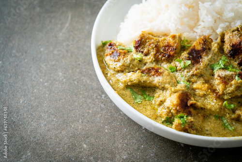 Afghani chicken in green curry or Hariyali tikka chicken hara masala with rice photo