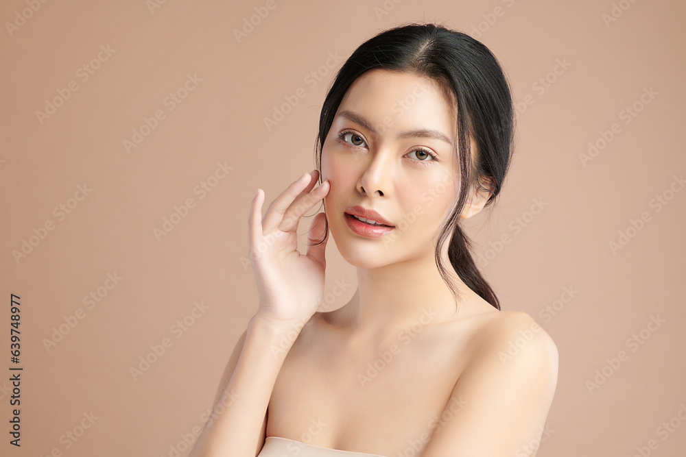 Beautiful young asian woman with clean fresh skin on beige background, Face care, Facial treatment, Cosmetology, beauty and spa, Asian women portrait. Beautiful young asian woman with clean fresh skin on beige background, Face care, Facial treatment, Cosmetology, beauty and spa, Asian women portrait.