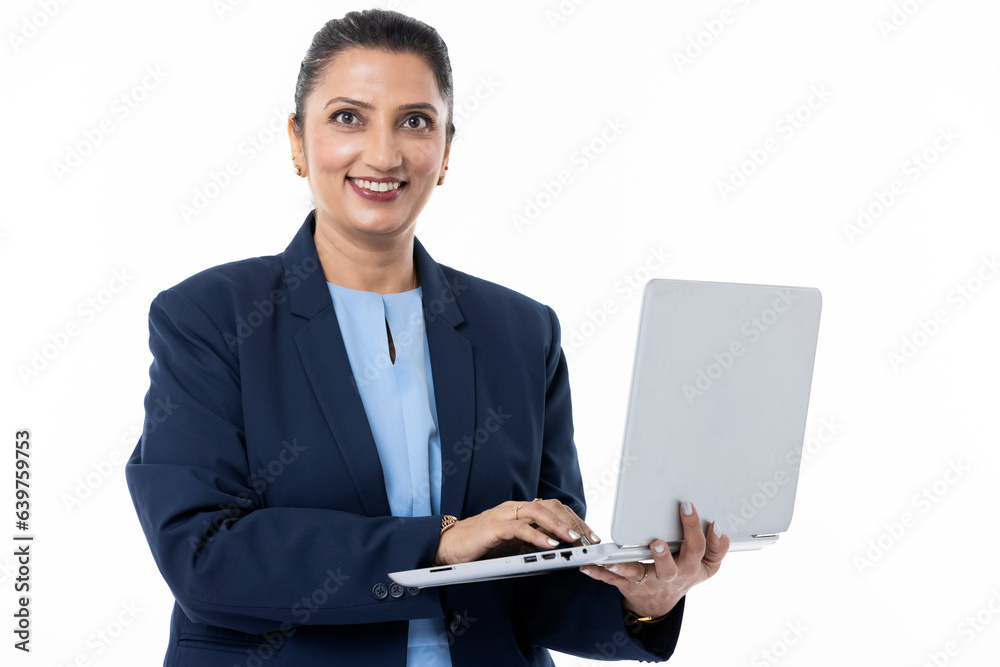 Attractive young Indian business woman with laptop against white background.
