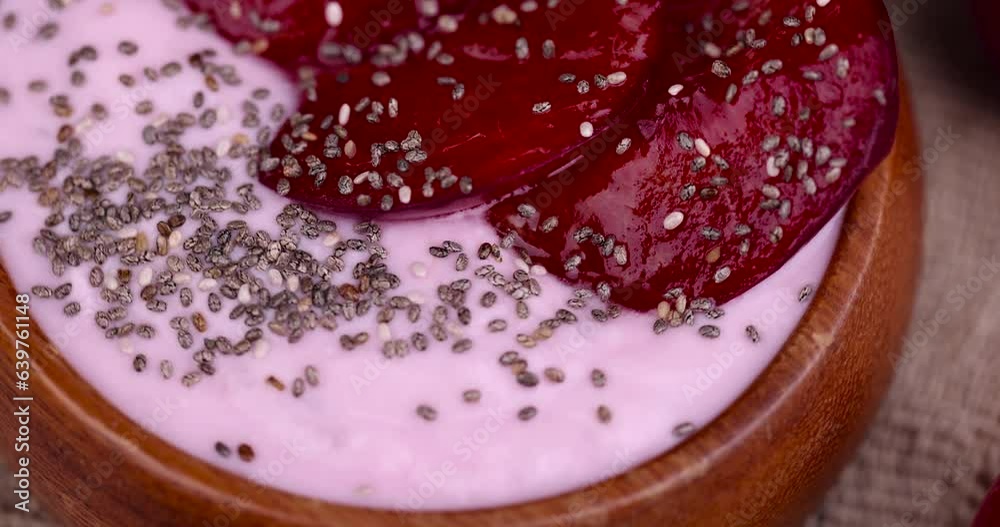 flavored pink yogurt with ripe and sweet plum, preparation of dairy products with aroma and pieces of red plum flavored pink yogurt with ripe and sweet plum, preparation of dairy products with aroma and pieces of red plum