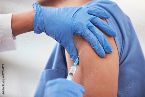 Covid vaccine, needle and arm of patient with doctor at hospital for immunization treatment closeup. Nurse, hands and vaccination, shot or injection for person at clinic for compliance or prevention
