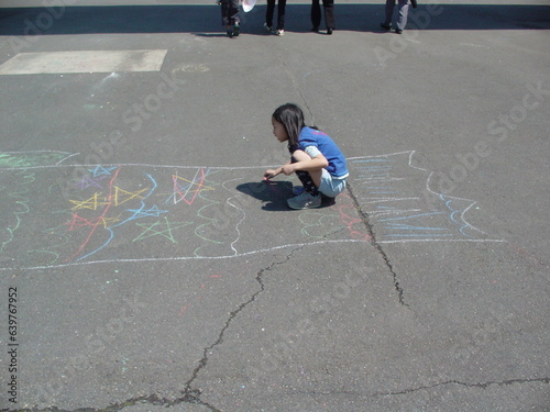 child playing with chalk