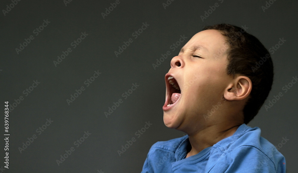little child yawning with open mouth on dark background with people stock image stock photo little child yawning with open mouth on dark background with people stock image stock photo