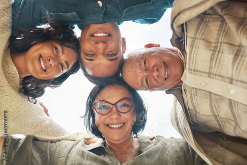 Portrait, smile and family in a huddle with senior parents from below during a summer day closeup. Love, support and elderly people with a son or daughter in law in a circle together for bonding