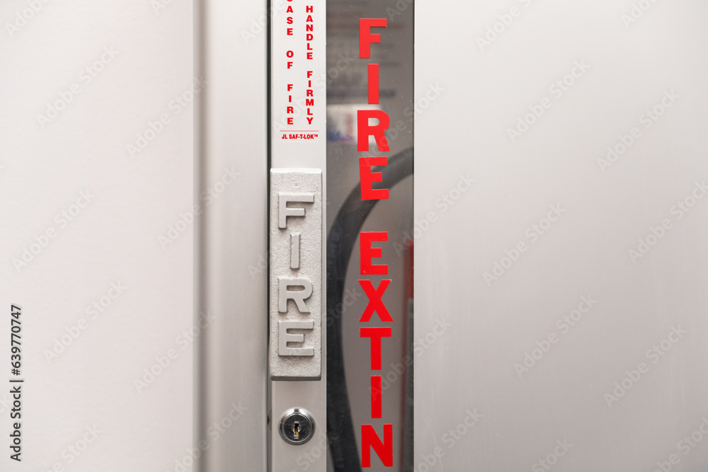 Fire extinguisher and sign depicting safety, urgency, preparedness, red ...