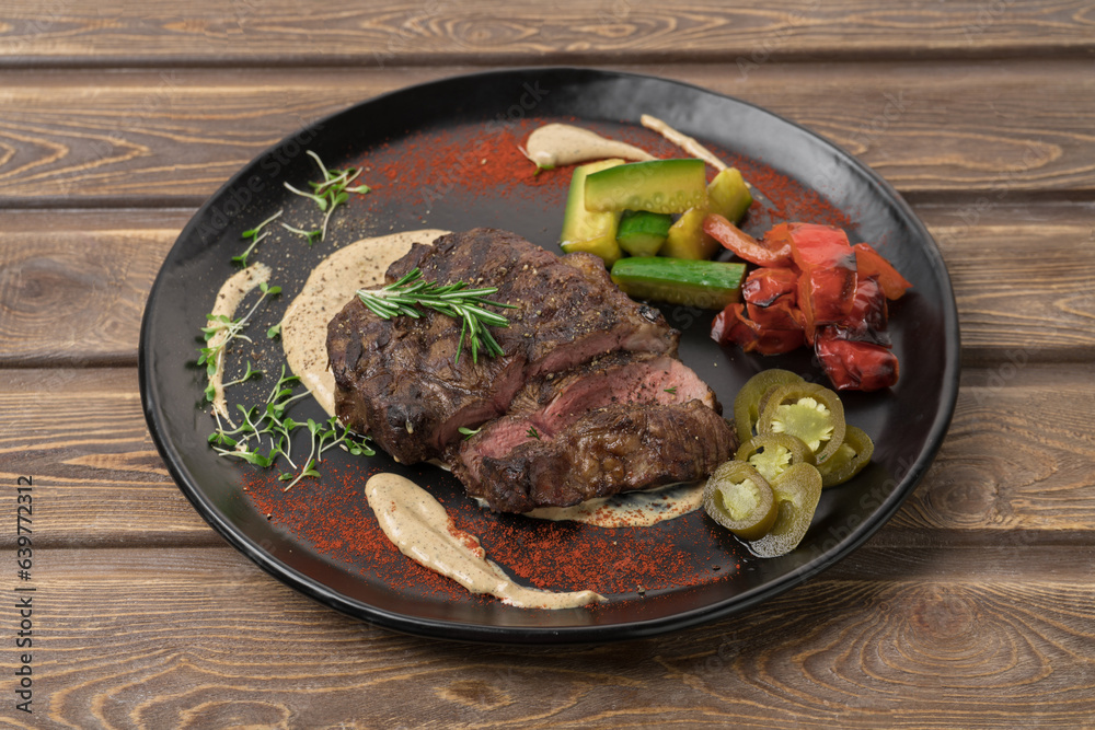 Grilled meat steak on a plate, restaurant menu Grilled meat steak on a plate, restaurant menu