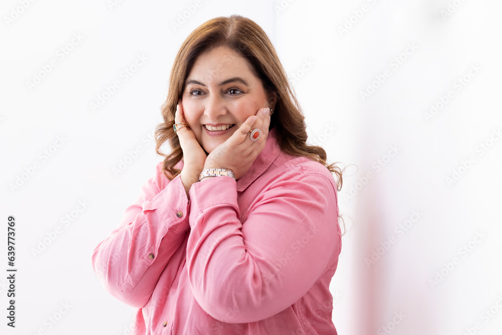 Surprised senior woman standing with shocked and amazed expression. Isolated on white Surprised senior woman standing with shocked and amazed expression. Isolated on white