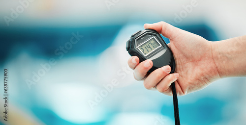 Hand, stopwatch and mockup with a fitness coach closeup in a sports center for time or training. Clock, exercise and cardio or endurance with a personal trainer for marathon motivation or challenge