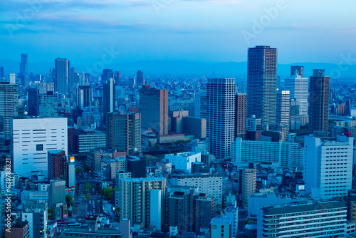 A dusk cityscape by high angle view near the office buildings in Osaka 
