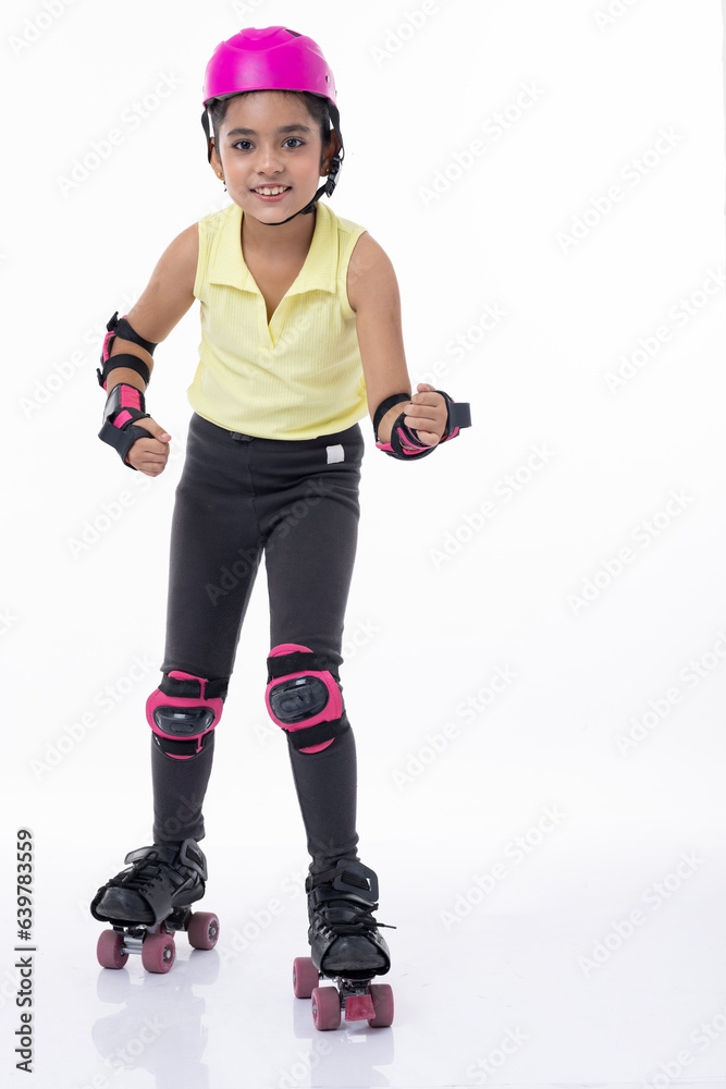 Full length portrait a happy girl on rollers isolated on white background Full length portrait a happy girl on rollers isolated on white background