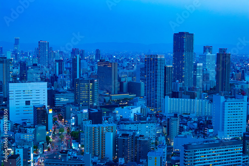 A dusk cityscape by high angle view near the office buildings in Osaka 