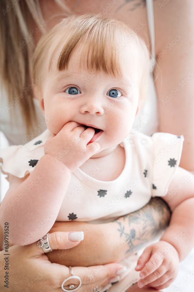 Close up portrait of infant girl. Kids emotions. Facial portrait of a baby. Happy childhood Close up portrait of infant girl. Kids emotions. Facial portrait of a baby. Happy childhood