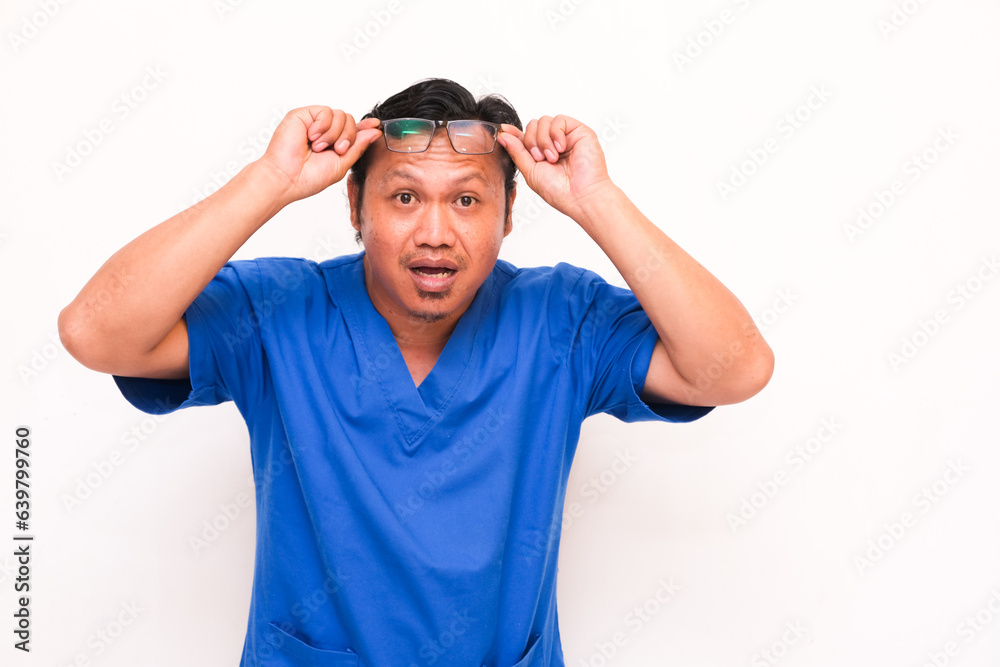 shocked asian man expression holding up goggles isolated white background shocked asian man expression holding up goggles isolated white background