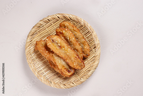Kluay Kaek is Thai Banana Fritters with Sesame Seed, Popular Street Food.  photo