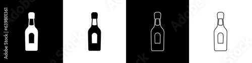 Set Champagne bottle icon isolated on black and white background. Vector