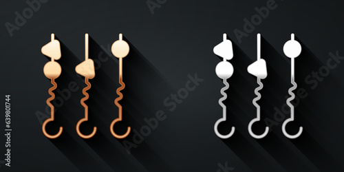 Gold and silver Grilled shish kebab on skewer stick icon isolated on black background. Meat kebab on skewer stick. Picnic with grilled meat. Long shadow style. Vector