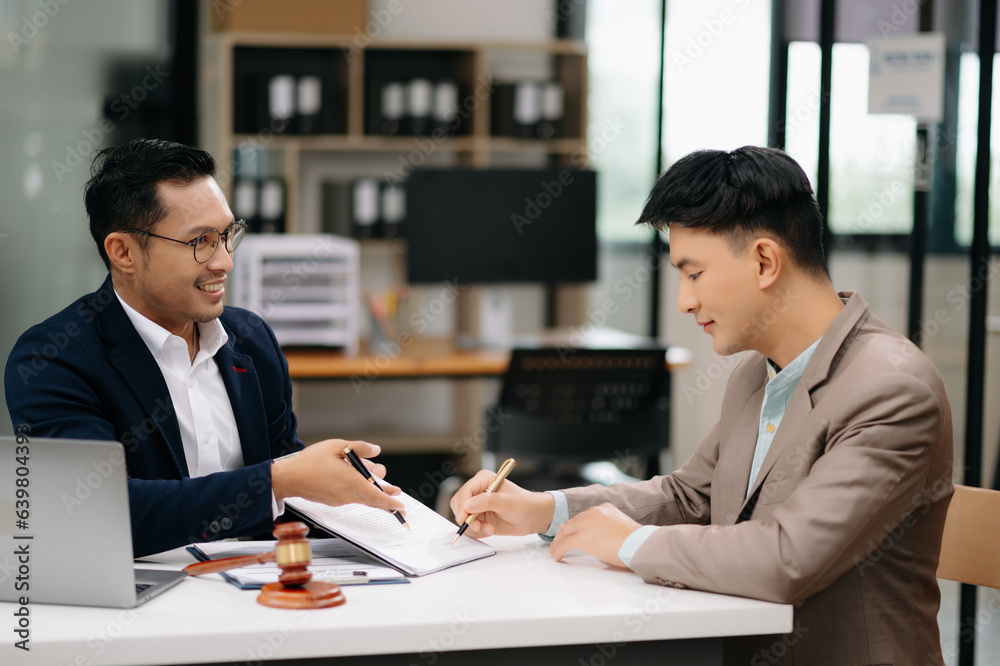 business people and lawyers discussing contract papers sitting at the table. Concepts of law, advice, legal services. business people and lawyers discussing contract papers sitting at the table. Concepts of law, advice, legal services.