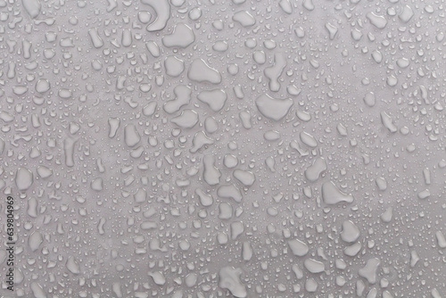 Water droplets on the gray background.