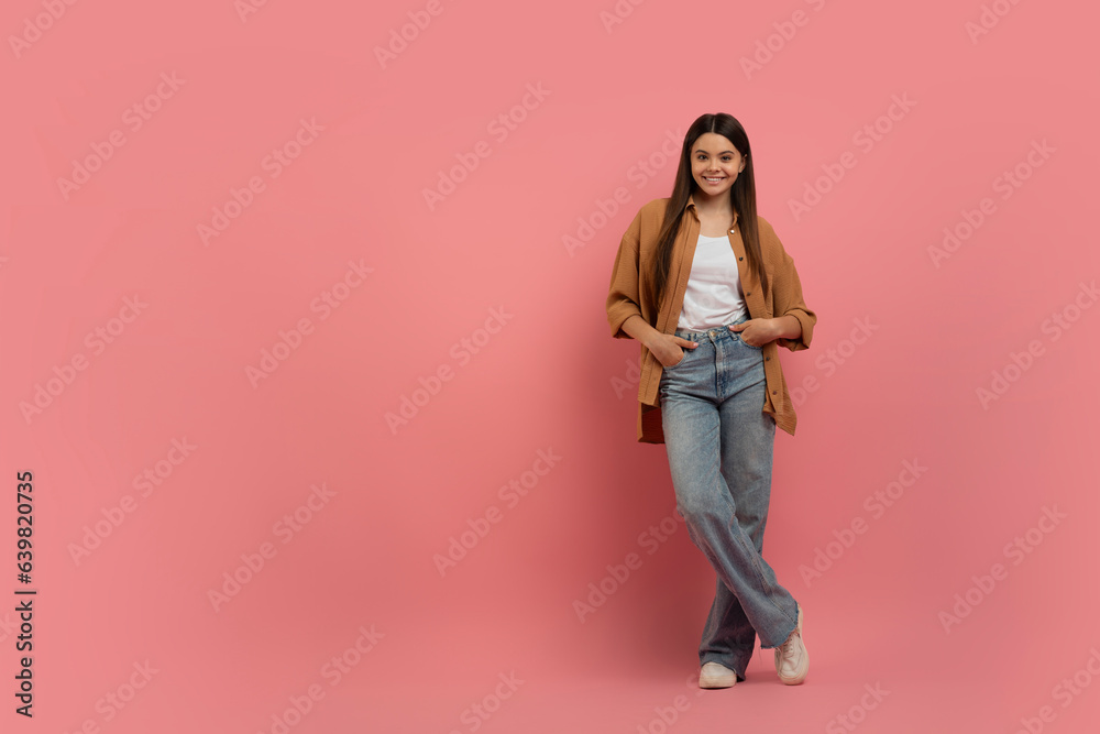 Portrait Of Beautiful Teen Girl In Casual Clothes Standing On Pink Background Portrait Of Beautiful Teen Girl In Casual Clothes Standing On Pink Background