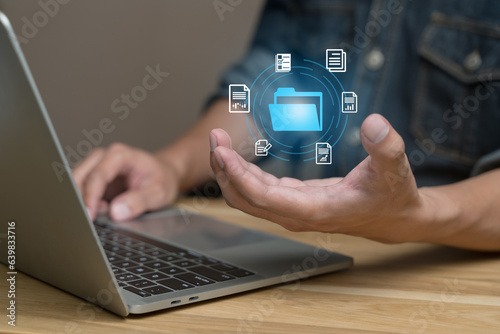 Virtual Intelligence (Ai) documents file search concept. Hands man holding media file on laptop in office. Businessman select report from company database. security system, Internet cloud connection