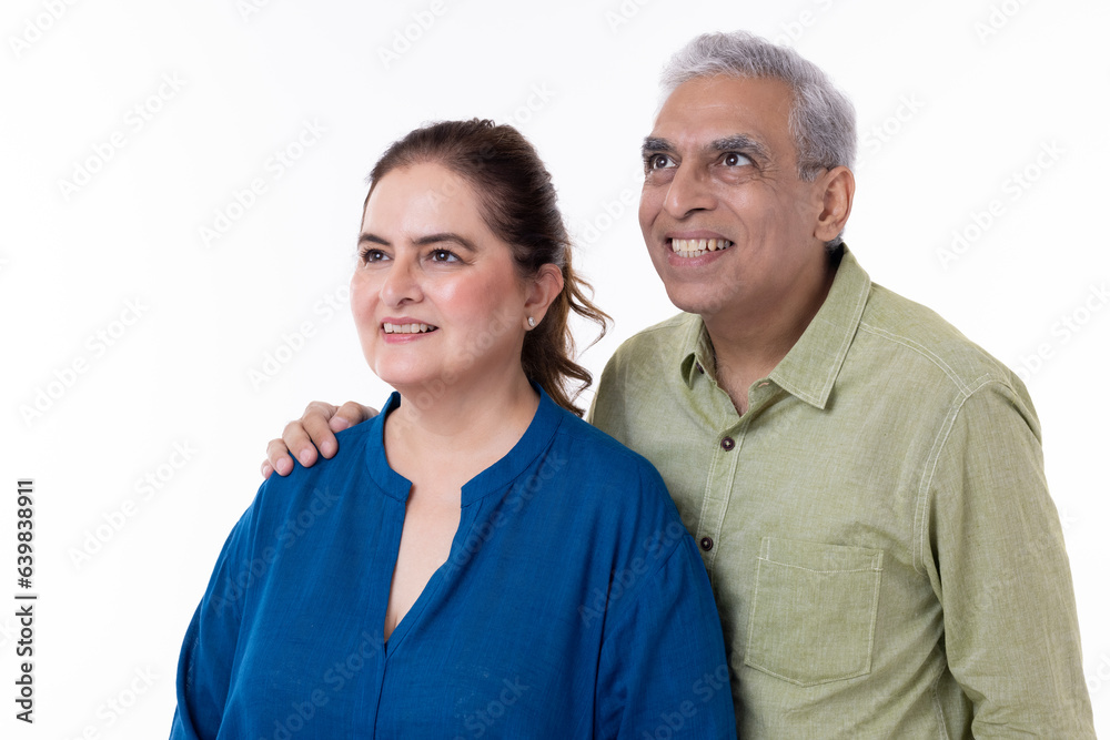 Portrait of loving senior couple over white background Portrait of loving senior couple over white background