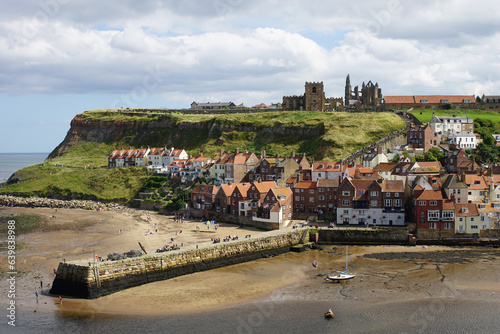 Whitby – with the 13 century Abbey  and the Church of Saint Mary on the cliff overlooking the town,  North Yorkshire, England - famously linked by Bram Stoker's novel Dracula. photo