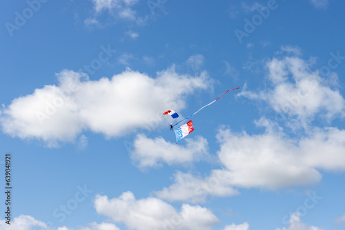 paratroopers in the air with the flags of France