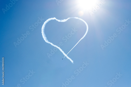 heart drawn in the sky by planes