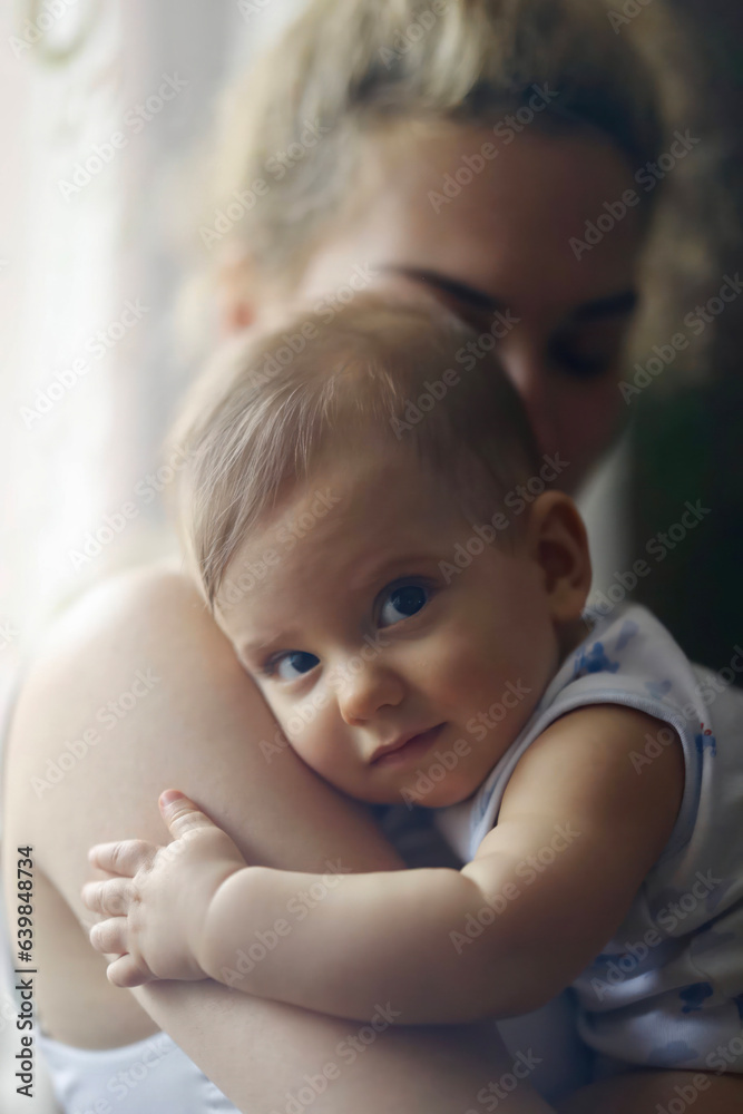 Embracing Motherhood: A Mother's Tender Hold on Her Baby Embracing Motherhood: A Mother's Tender Hold on Her Baby