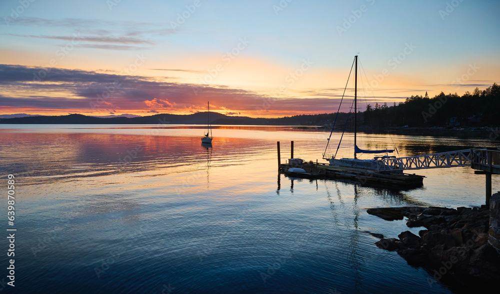 sailboat in Halfmoon Bay. sunset over the sea. Sunshine Coast, British Columbia, Canada