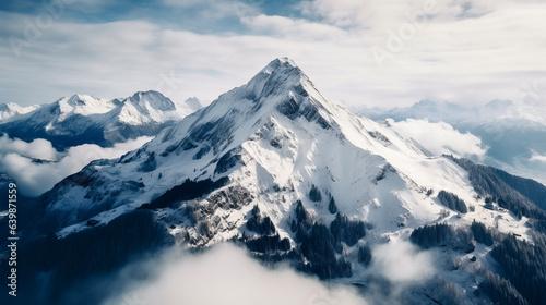 Drone photo of a mountain in Austrian Alps in winter.  © @foxfotoco