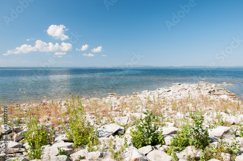 Summer view of lake Uvildy with stones on its shoreline, South Urals, Russian Federation photo