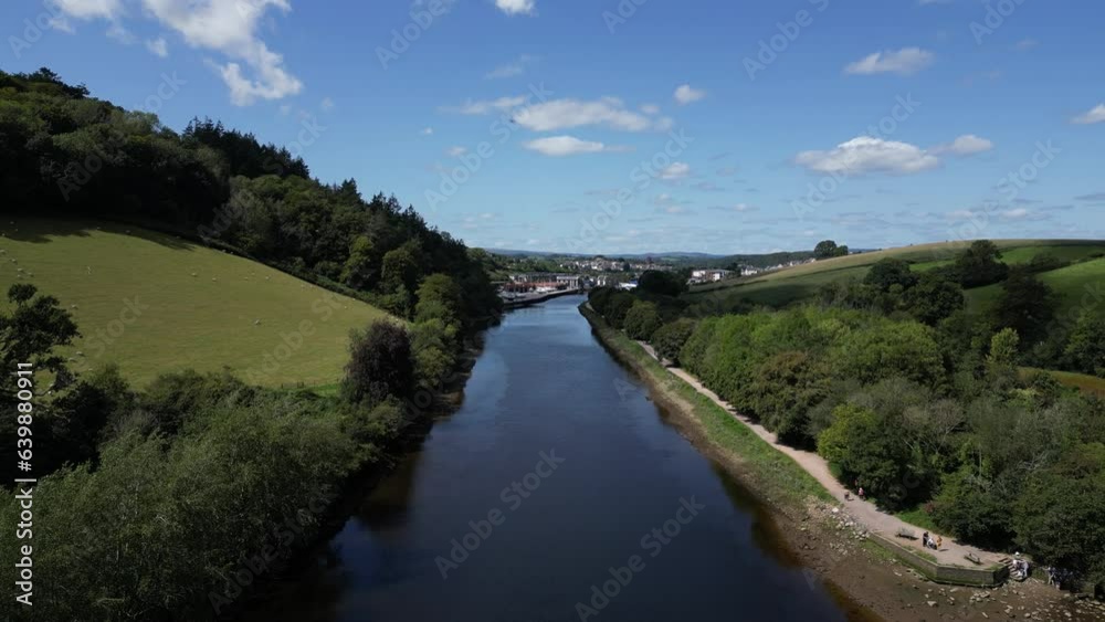 River Dart, near Totnes, South Devon, England: DRONE VIEWS: The drone flies northwards over the River Dart heading towards the town of Totnes. Totnes is a popular UK tourist destination. River Dart, near Totnes, South Devon, England: DRONE VIEWS: The drone flies northwards over the River Dart heading towards the town of Totnes. Totnes is a popular UK tourist destination.