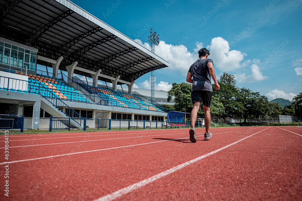 Fit athlete men do running exercise physical workout routine in sportswear with power confidence training at race track stadium for healthy lifestyle preparing practicing marathon jogging competition