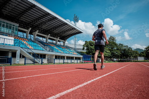 Fit athlete men do running exercise physical workout routine in sportswear with power confidence training at race track stadium for healthy lifestyle preparing practicing marathon jogging competition